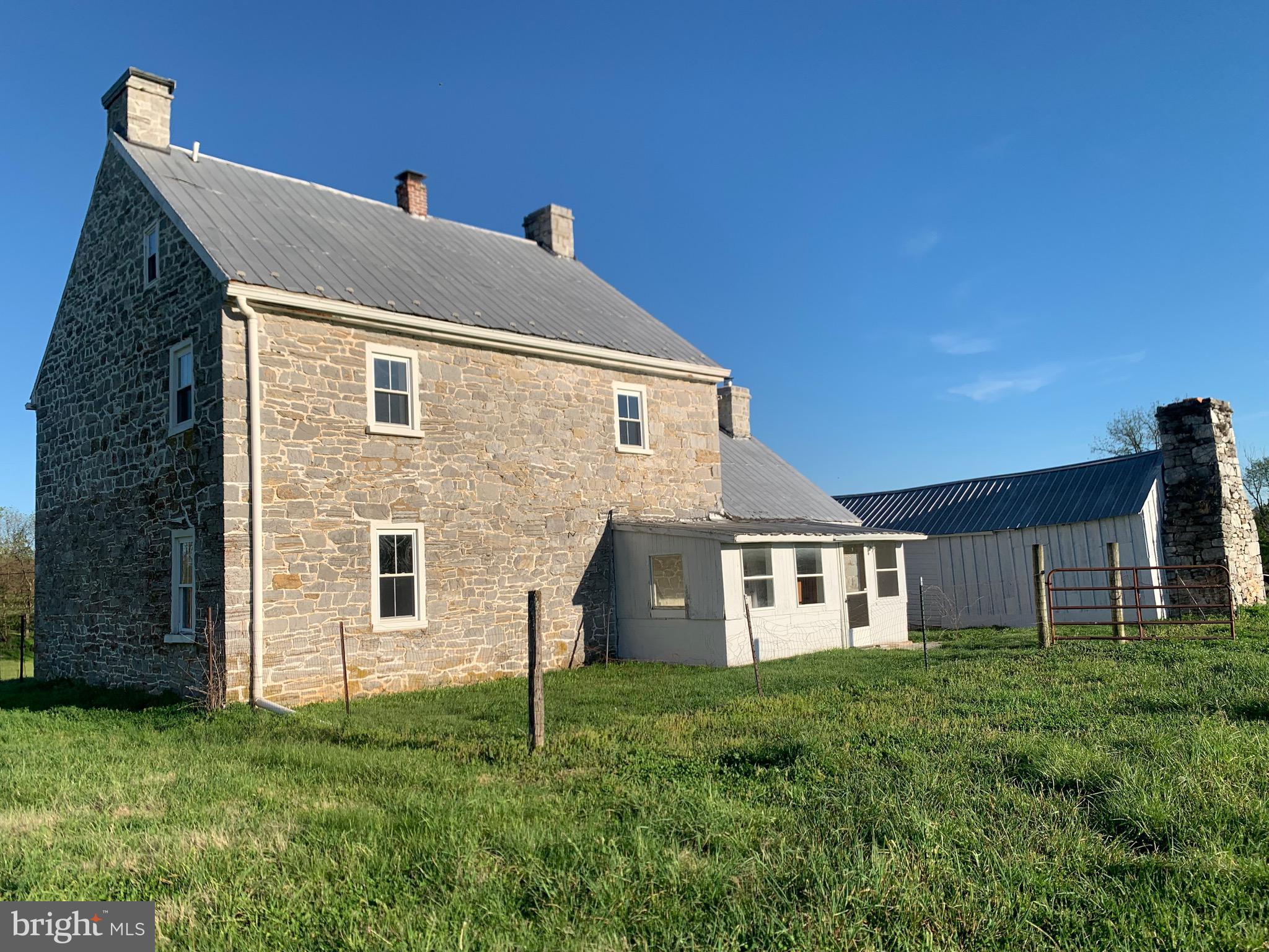 7234 Tommytown Road Sharpsburg, MD 21782 - Photo 5 of 40 a front view of a house with a yard
