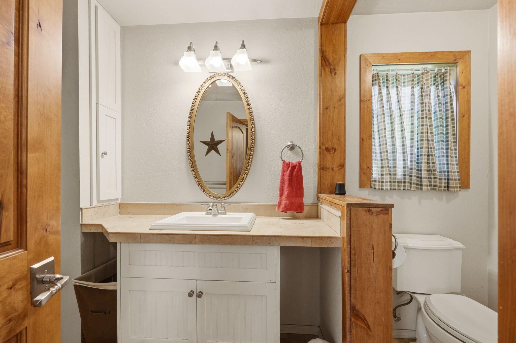 985 Elliott Creek Road Wilderville, OR 97543 - Photo 68 of 98 a bathroom with a toilet sink and mirror