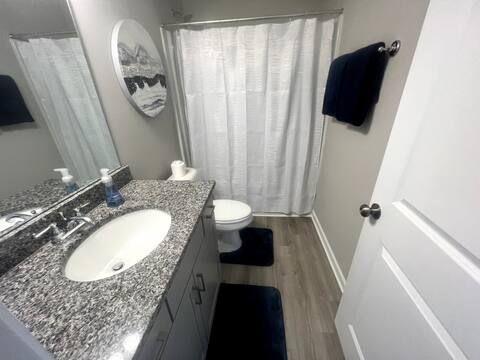 2788 Laurel Ridge Circle Atlanta, GA 30344 - Photo 13 of 16 a bathroom with a granite countertop sink and a mirror