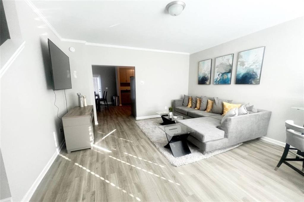 2788 Laurel Ridge Circle Atlanta, GA 30344 - Photo 2 of 16 a living room with furniture and a flat screen tv