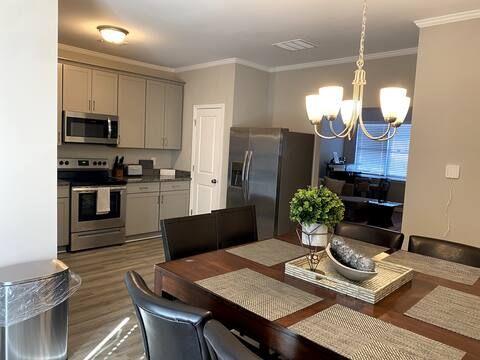 2788 Laurel Ridge Circle Atlanta, GA 30344 - Photo 3 of 16 a kitchen with a table chairs refrigerator and microwave