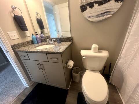 2788 Laurel Ridge Circle Atlanta, GA 30344 - Photo 7 of 16 a bathroom with a toilet sink and mirror