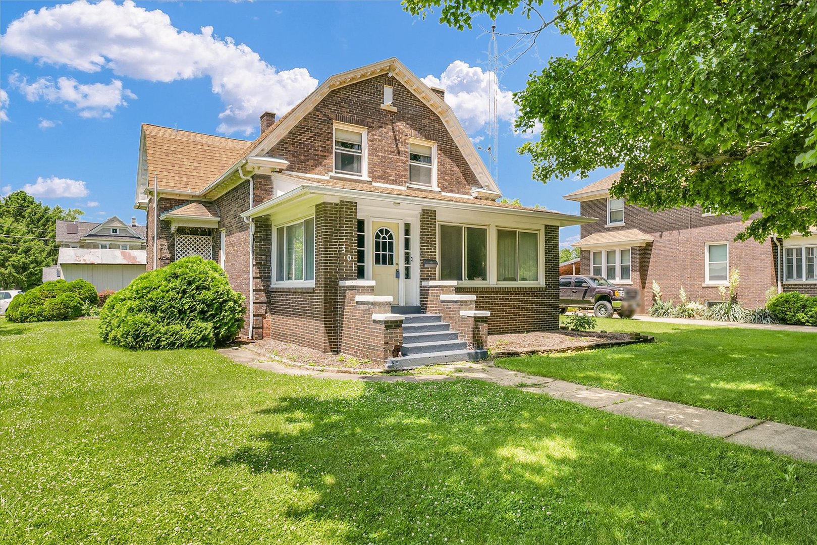 301 North Main Street Fithian, IL 61844 - Photo 2 of 53 a front view of a house with a garden and patio