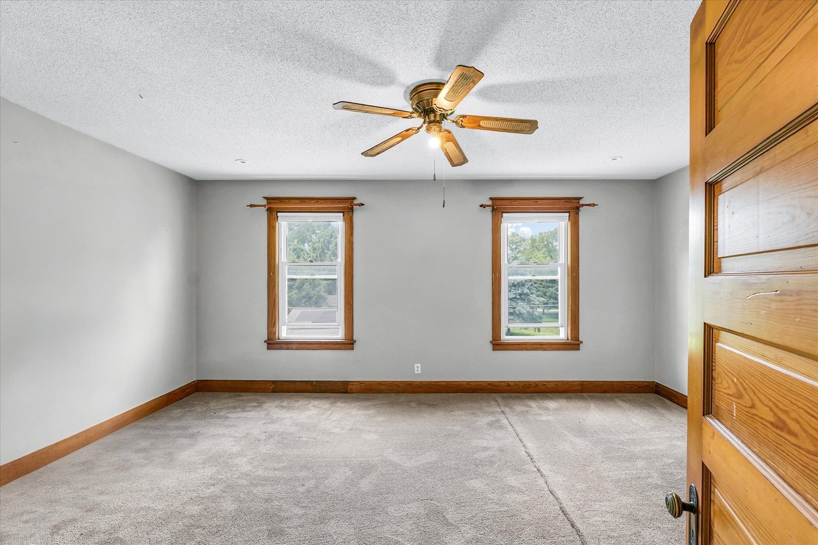 301 North Main Street Fithian, IL 61844 - Photo 33 of 53 a view of an empty room with window and wooden floor