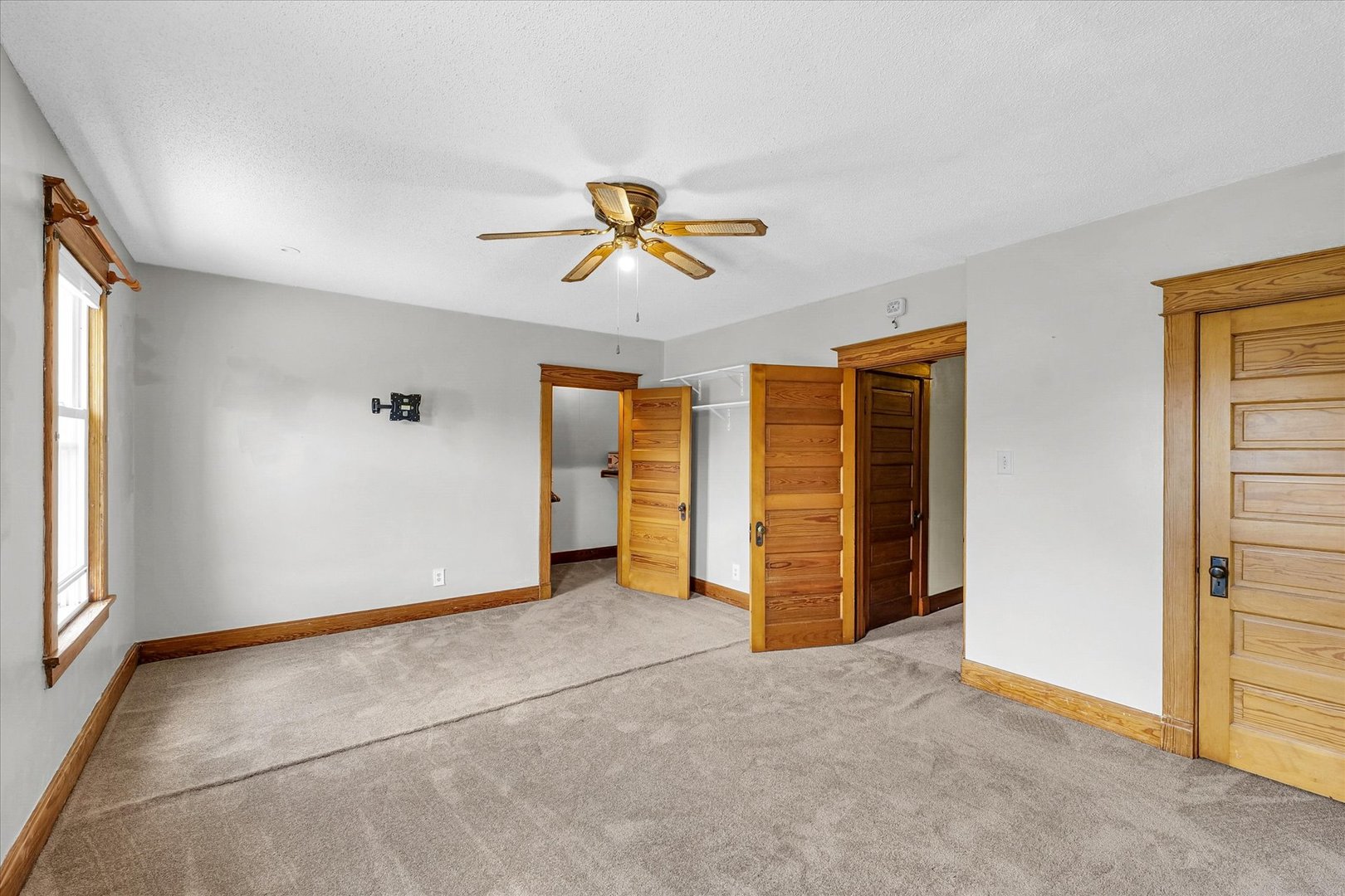 301 North Main Street Fithian, IL 61844 - Photo 34 of 53 an empty room with closet and fan