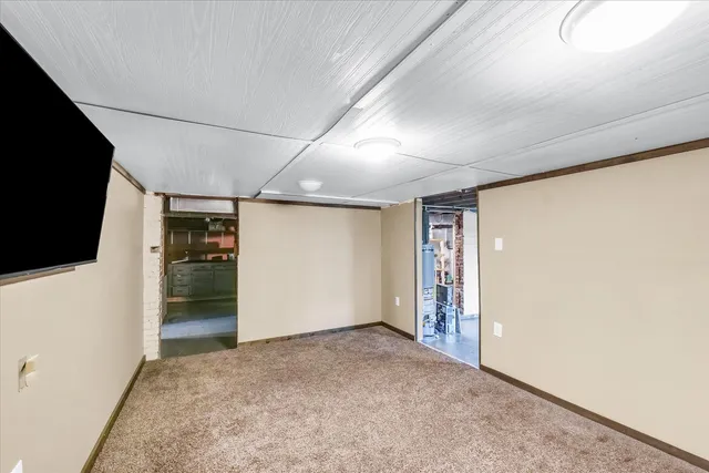 a view of room with stairs and a ceiling fan