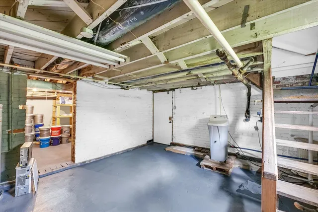 a view of a storage room with wooden floor
