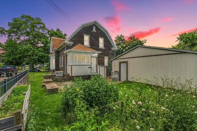 a house with garden in front of it