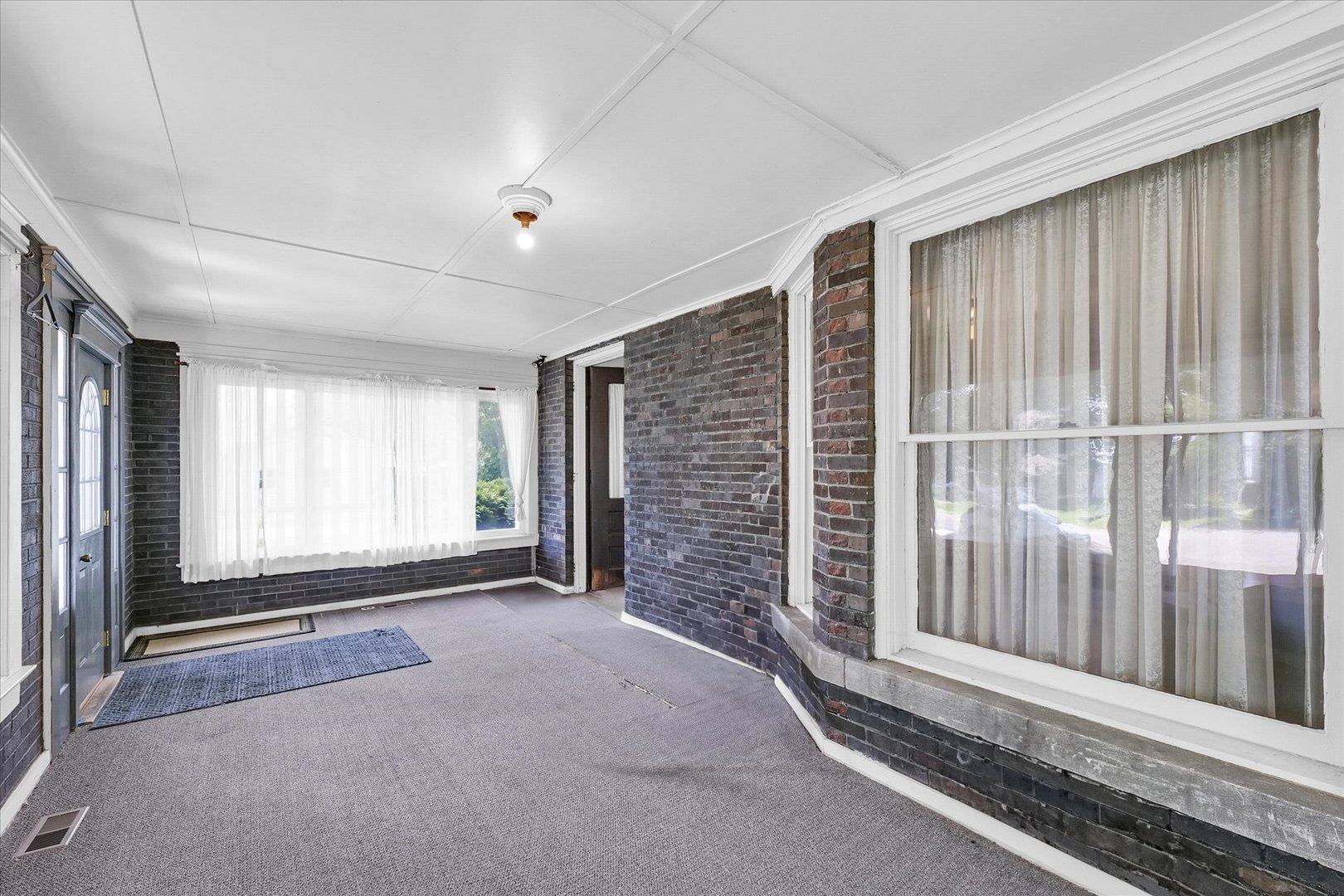 301 North Main Street Fithian, IL 61844 - Photo 5 of 53 a view of an empty room with a fireplace and a window