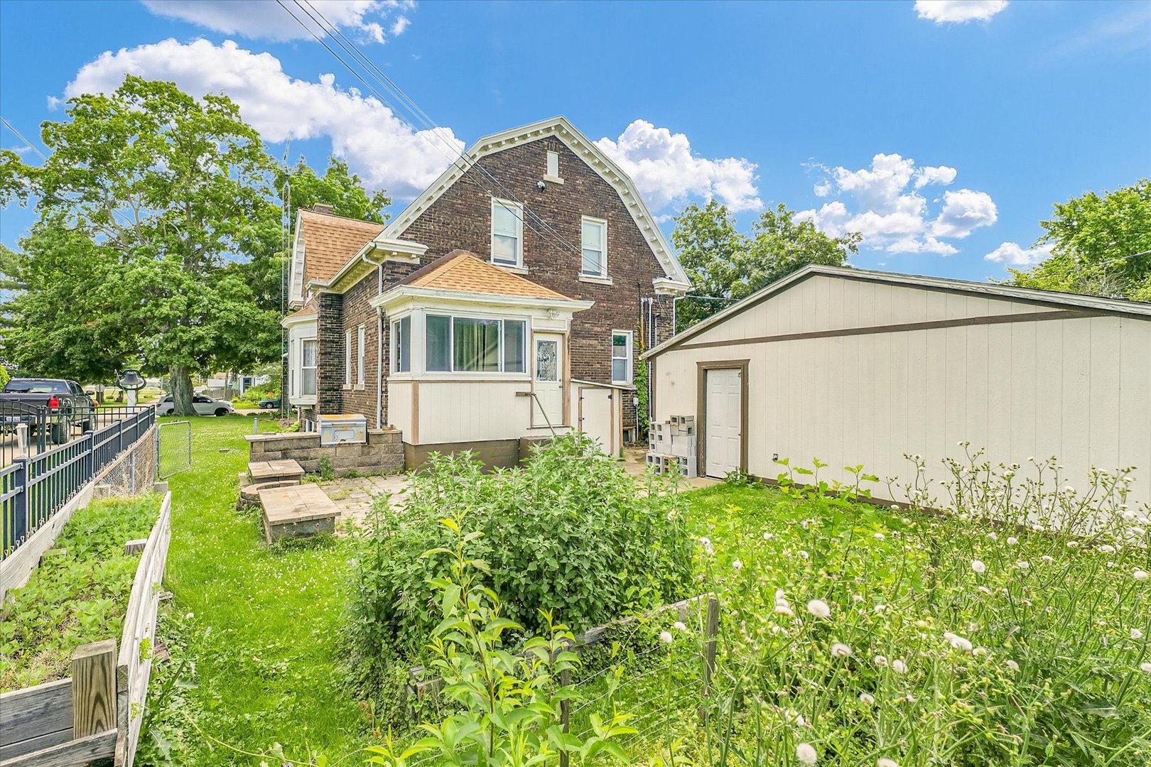 301 North Main Street Fithian, IL 61844 - Photo 51 of 53 a house with garden in front of it