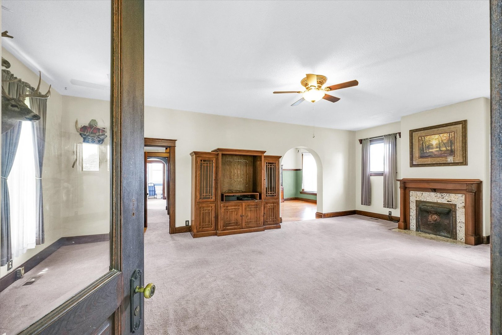 301 North Main Street Fithian, IL 61844 - Photo 7 of 53 a view of an empty room with window and a fireplace