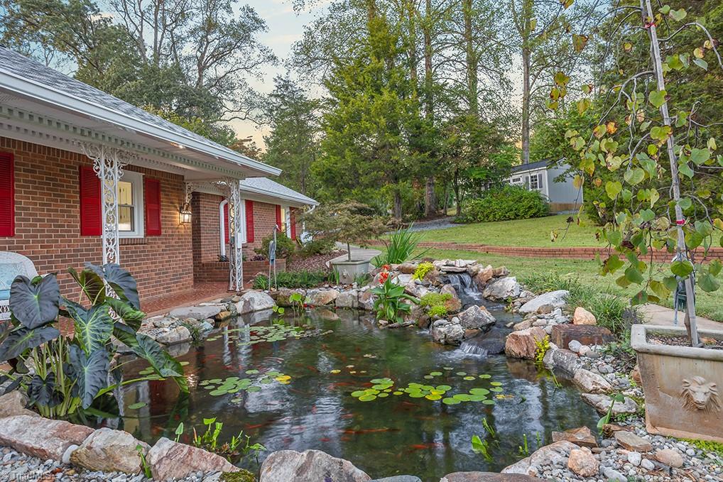 120 Buckhaven Court Rural Hall, NC 27045 - Photo 3 of 47 The newly renovated koi pond now provides ease of maintenance and comes with a netted cover to keep out Autumn leaves and debris.