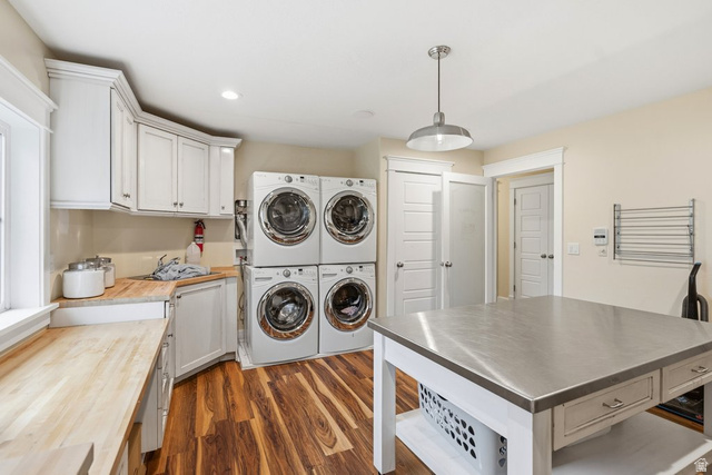 672 Perry Hollow Drive Mapleton, UT 84664 - Photo 71 of 106 Laundry room featuring a quartet of stacked appliances, wood-finish countertops, white cabinetry, and a central island with a stainless steel surface