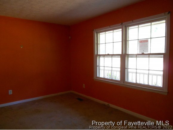 5862 Columbine Road Fayetteville, NC 28306 - Photo 3 of 10 an empty room with a window