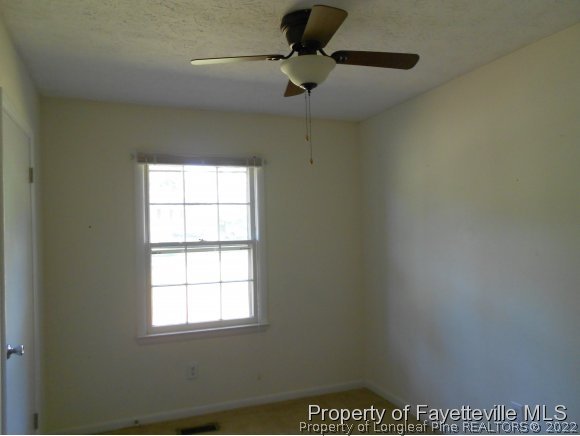 5862 Columbine Road Fayetteville, NC 28306 - Photo 6 of 10 an empty room with a window