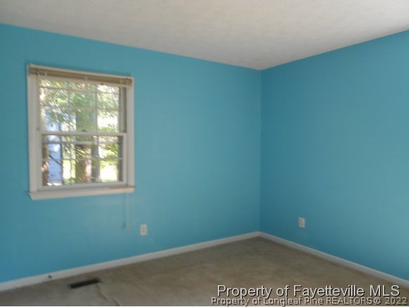 5862 Columbine Road Fayetteville, NC 28306 - Photo 8 of 10 an empty room with a window