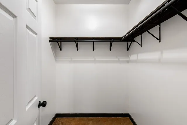 a view of house with a backyard