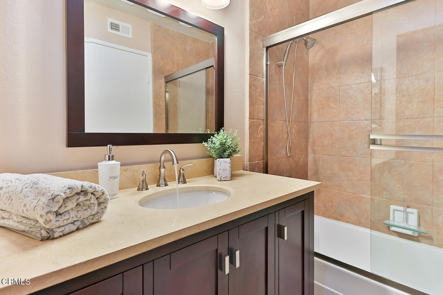 6159 Fremont Circle Camarillo, CA 93012 - Photo 34 of 48 a bathroom with a sink and a mirror