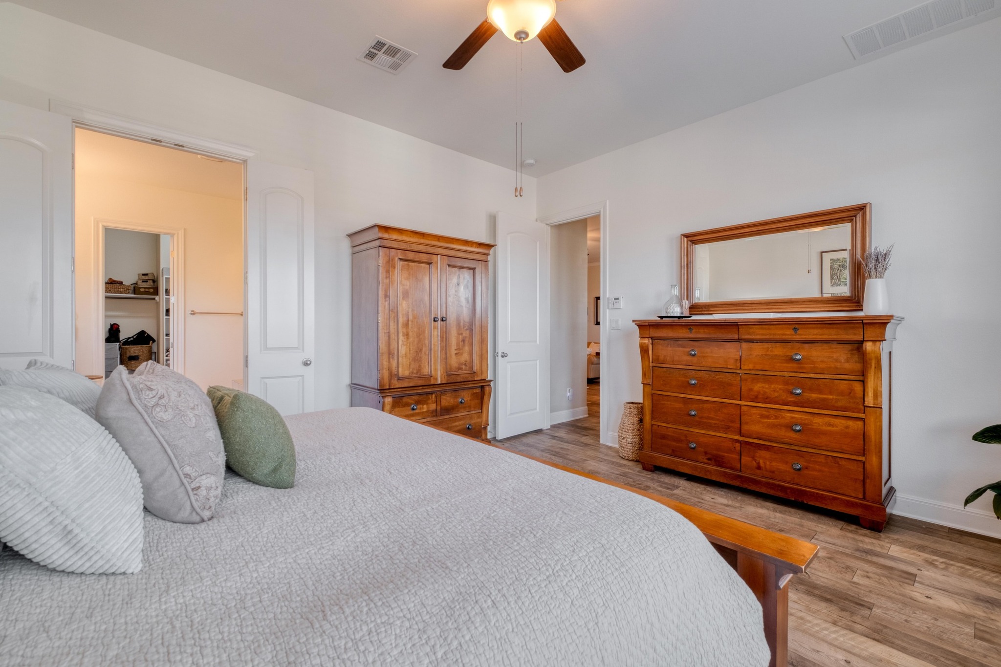 3204 Venezia View Leander, TX 78641 - Photo 12 of 28 One of two Primary Bedrooms featuring high ceiling and ceiling fan