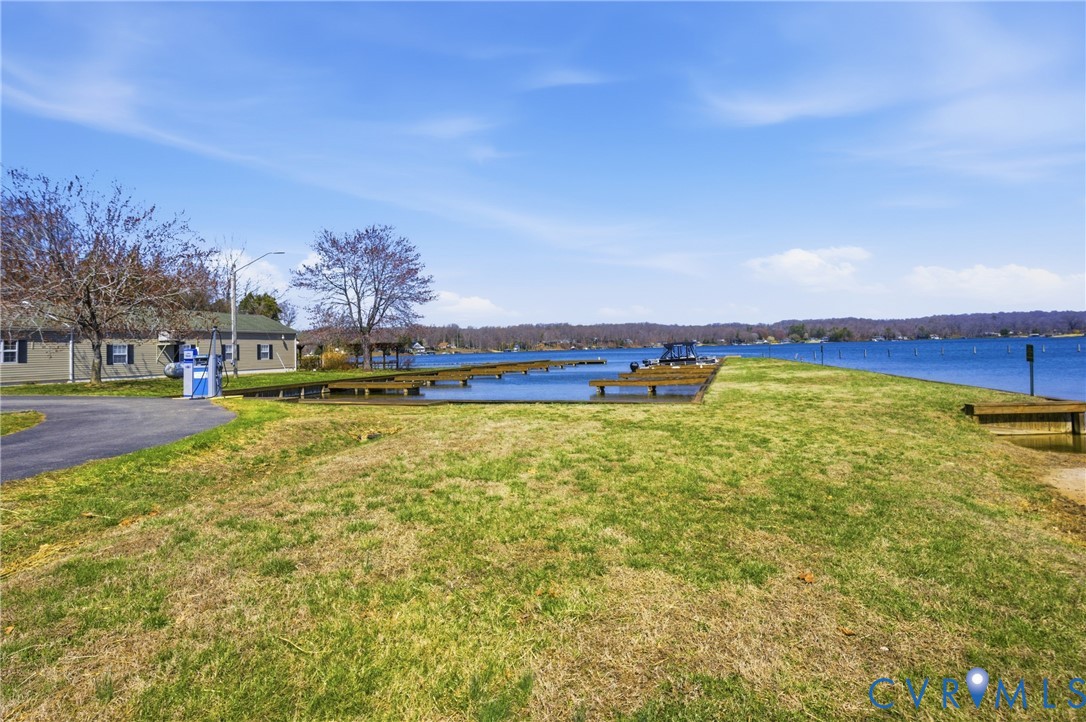 238 Ash Road Louisa, VA 23093 - Photo 36 of 43 a view of a swimming pool with an outdoor seating and deck