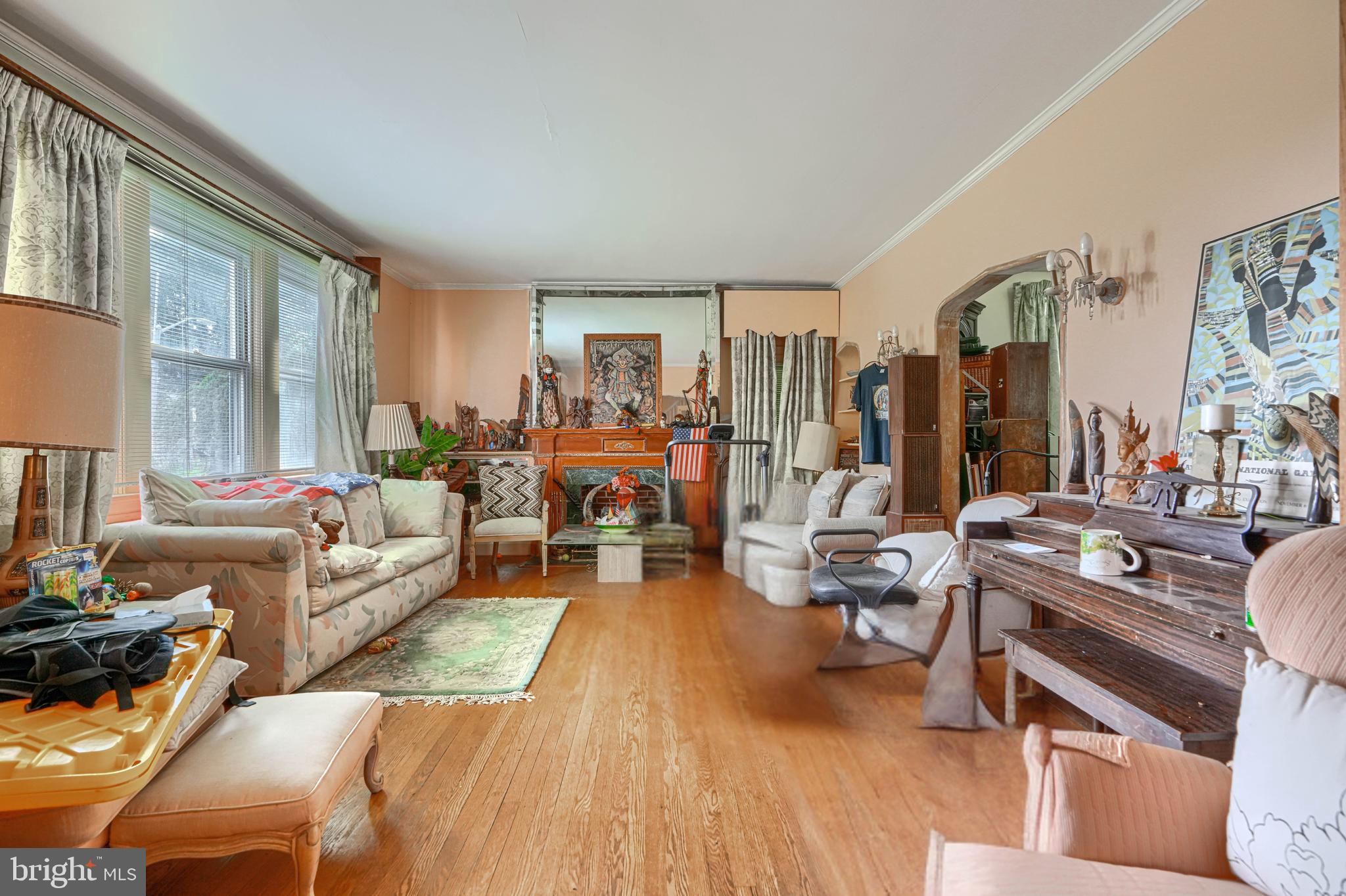 3212 Dorchester Road Baltimore, MD 21215 - Photo 12 of 45 a living room with furniture and a large window
