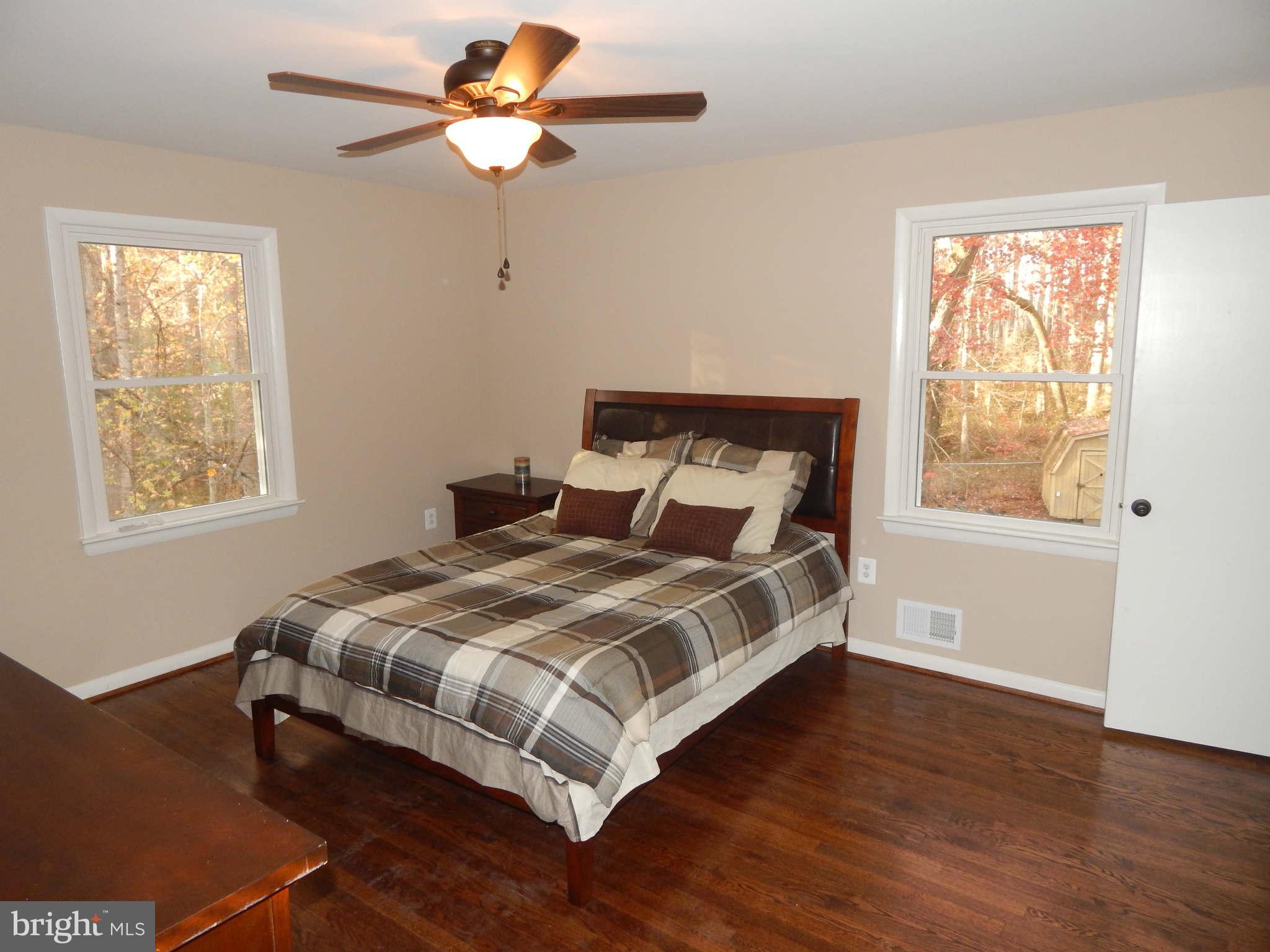 8515 Schultz Road Clinton, MD 20735 - Photo 14 of 30 a bedroom with a bed and a window