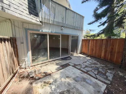a balcony with wooden fence