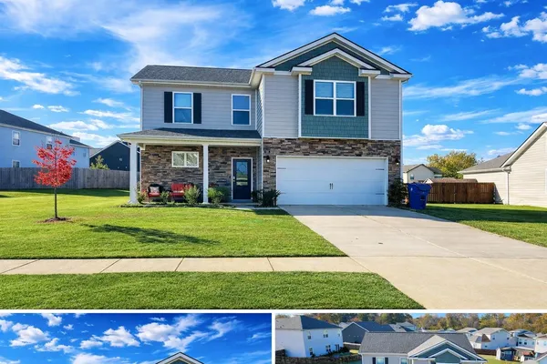 a front view of a house with a yard