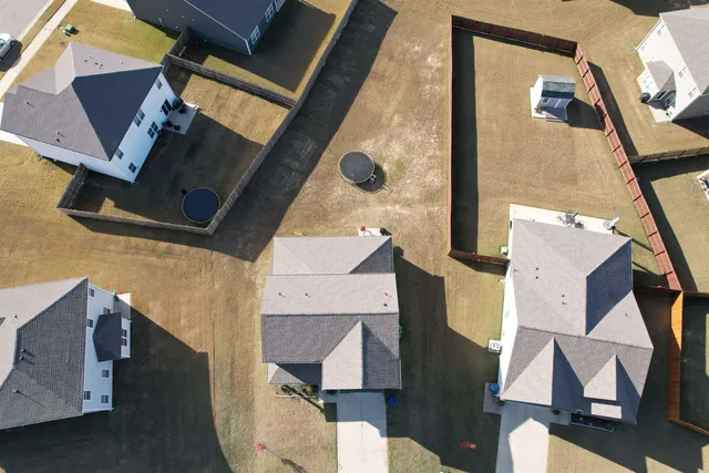an aerial view of residential houses with outdoor space