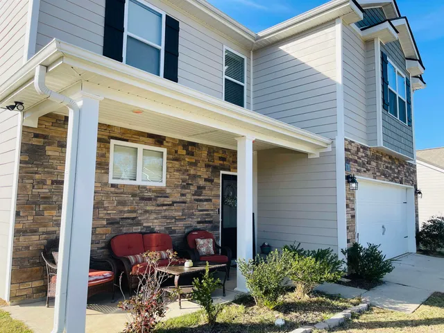 a front view of a house with patio
