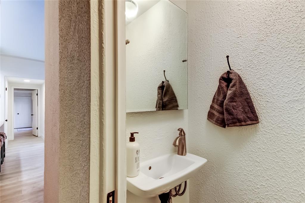 12625 Shell Point Drive Hudson, FL 34667 - Photo 33 of 61 a bathroom with a sink and a mirror