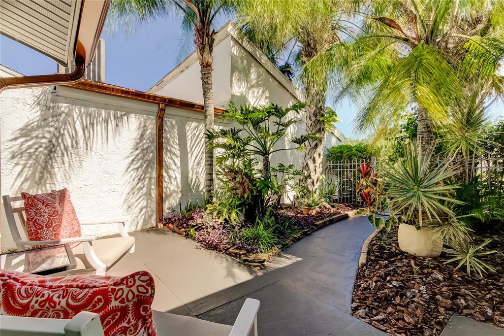 12625 Shell Point Drive Hudson, FL 34667 - Photo 4 of 61 a potted plant sitting in front of a house