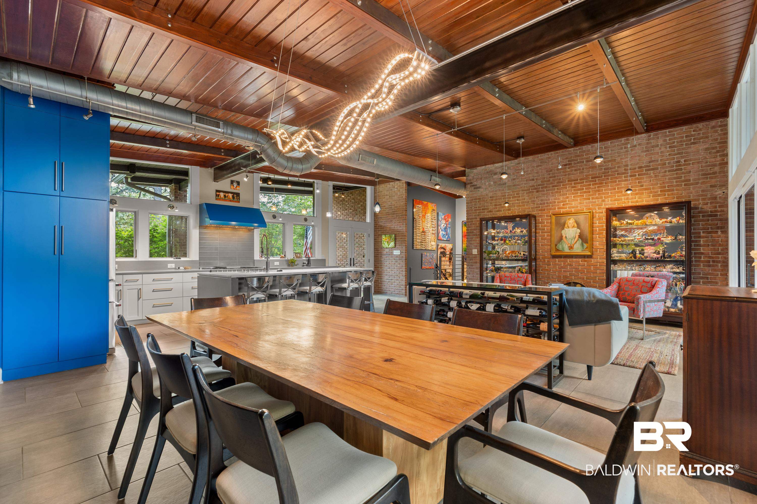 233 Suzanne Circle Mobile, AL 36608 - Photo 11 of 85 Dining space with brick wall, a wood ceiling with exposed beams, and a chandelier