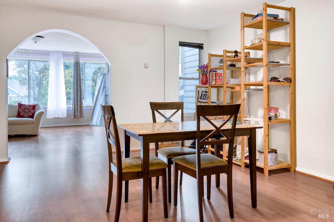 1128 Chester Street Oakland, CA 94607 - Photo 12 of 42 a view of a dining room with furniture and wooden floor