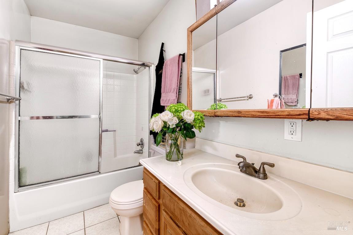 1128 Chester Street Oakland, CA 94607 - Photo 13 of 42 a bathroom with a sink toilet and shower