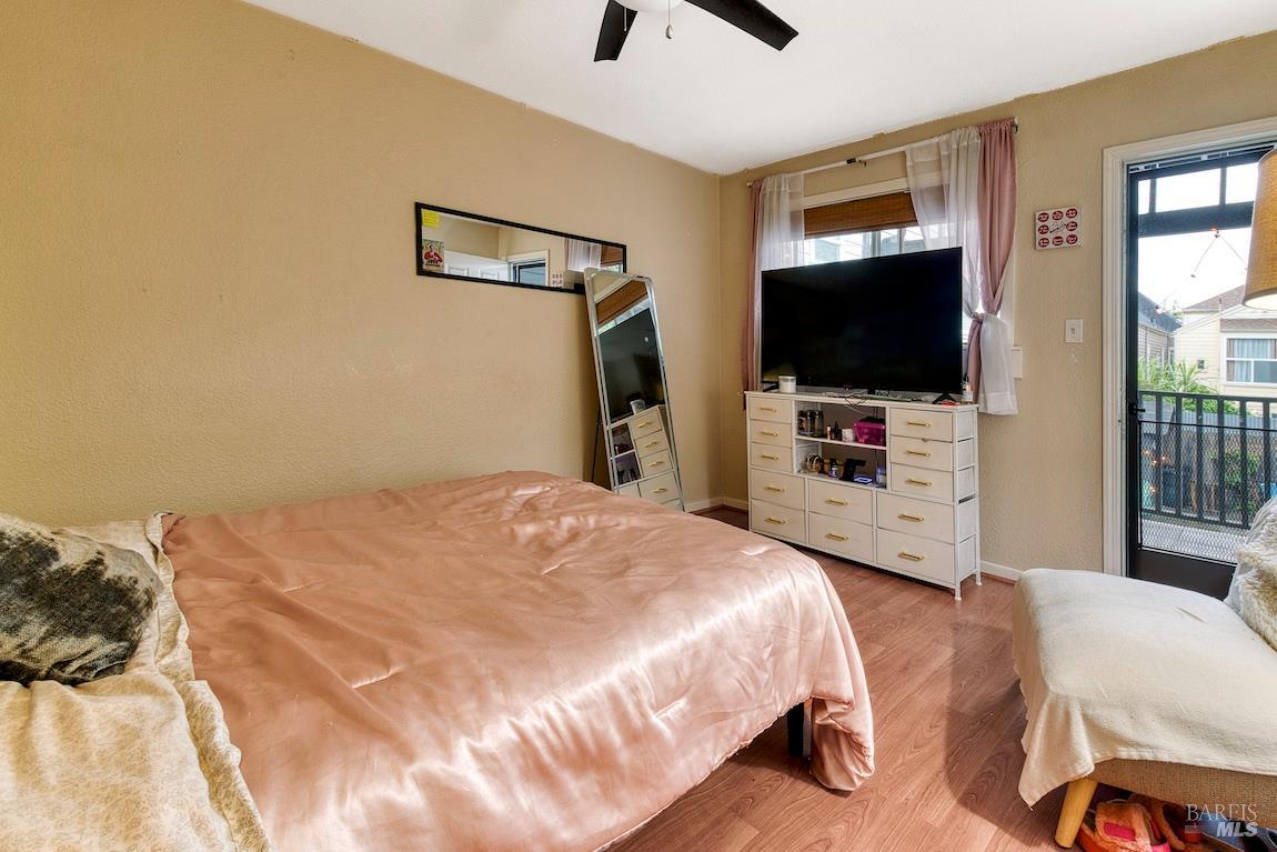 1128 Chester Street Oakland, CA 94607 - Photo 15 of 42 a bedroom with a bed and a flat screen tv