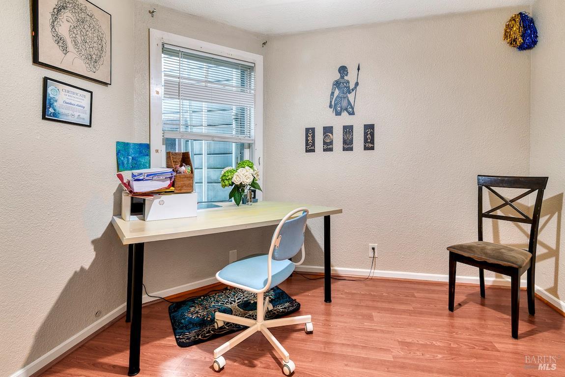 1128 Chester Street Oakland, CA 94607 - Photo 17 of 42 a workspace with furniture and wooden floor