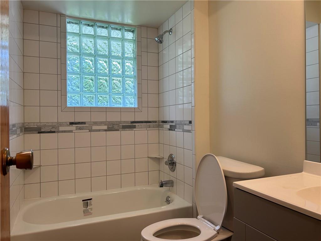 1631 Shady Plain Road Apollo, PA 15613 - Photo 17 of 36 a bath tub sitting next to a white toilet and a shower