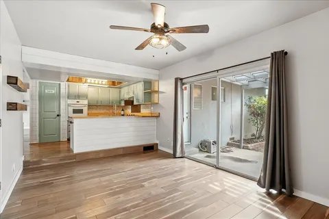 a view of a room with cabinet and mirrors