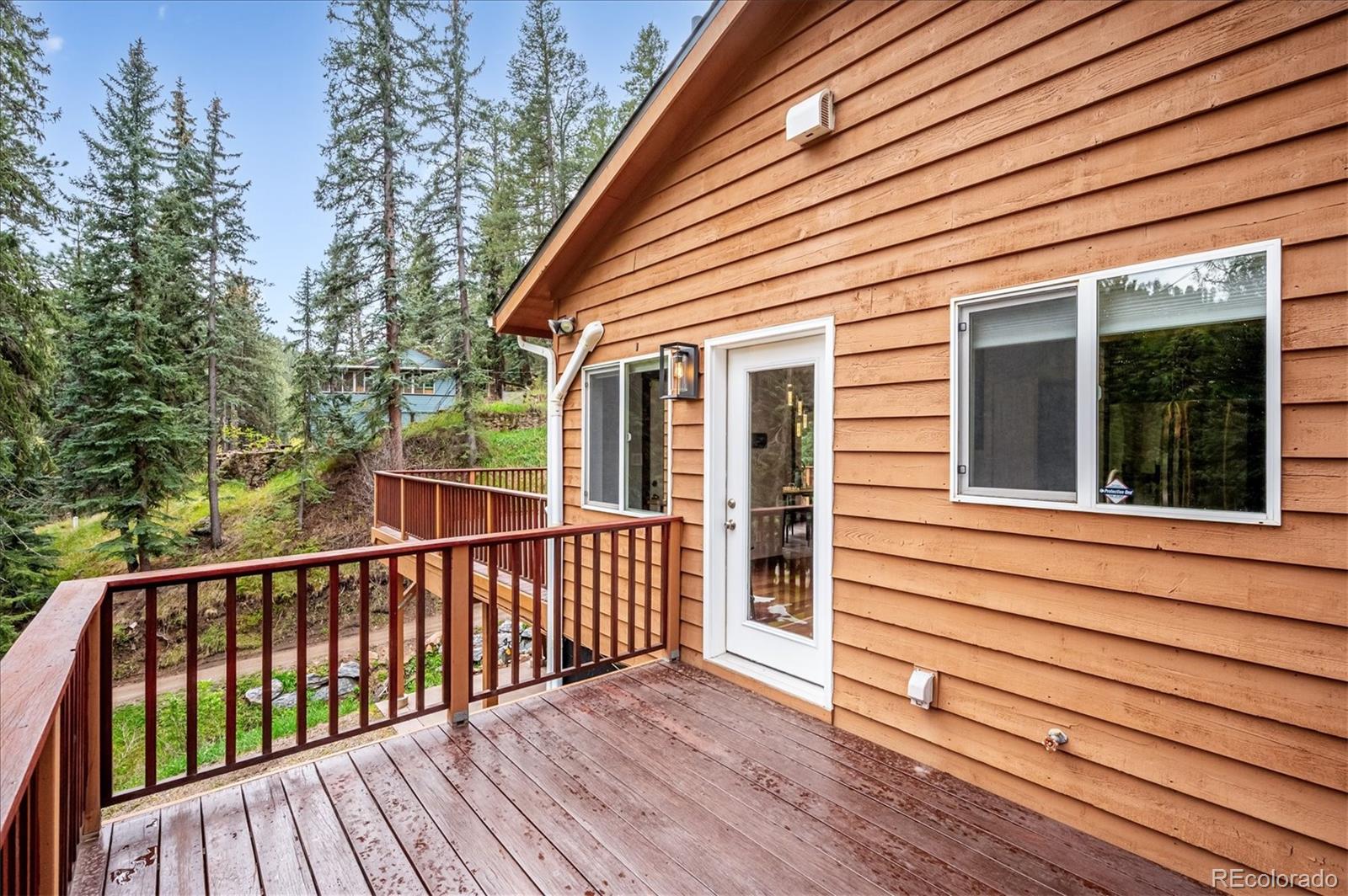 6747 South Brook Forest Road Evergreen, CO 80439 - Photo 40 of 49 a view of a wooden deck