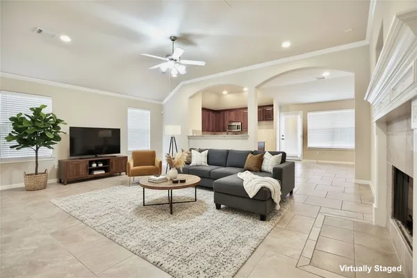 a living room with furniture and a flat screen tv