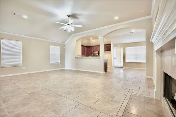 a spacious bathroom with a granite countertop double vanity sink and a mirror