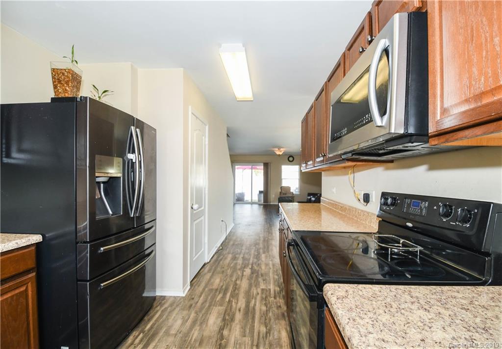 660 Potter Place Road Fort Mill, SC 29708 - Photo 11 of 23 a kitchen with stainless steel appliances granite countertop a refrigerator and a stove top oven