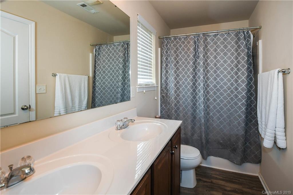 660 Potter Place Road Fort Mill, SC 29708 - Photo 15 of 23 a bathroom with a sink a toilet and shower curtain