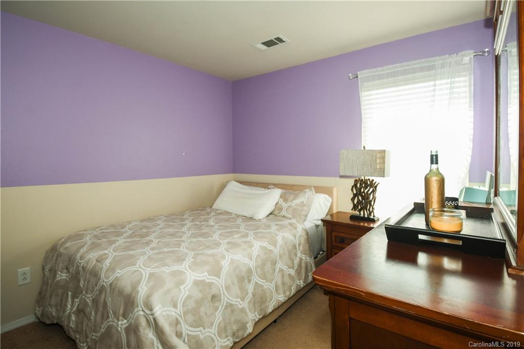 660 Potter Place Road Fort Mill, SC 29708 - Photo 16 of 23 a bed room with a bed and a night stand