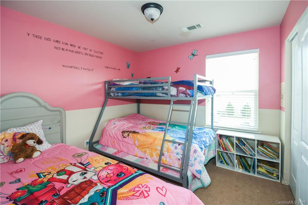 660 Potter Place Road Fort Mill, SC 29708 - Photo 17 of 23 a bedroom with a bed and a window