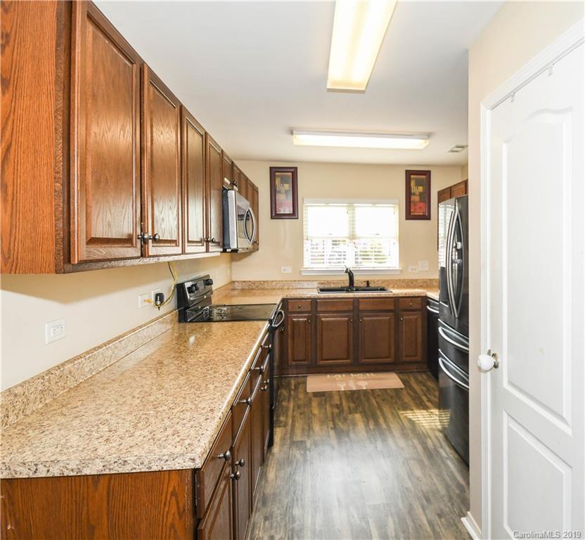 660 Potter Place Road Fort Mill, SC 29708 - Photo 8 of 23 a kitchen with a sink stove top oven and refrigerator