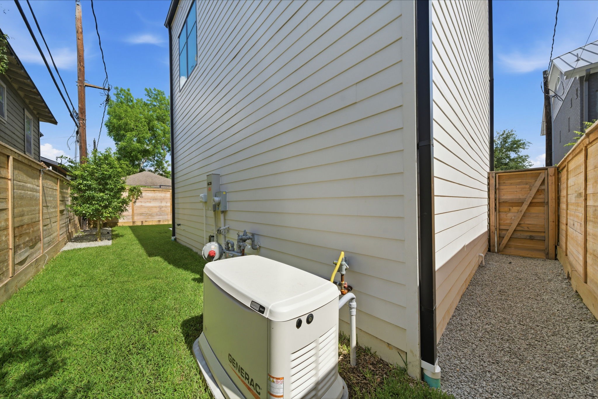 1023 Euclid Street Houston, TX 77009 - Photo 40 of 50 Additional green space, gravel pathway access, and whole-home Generac generator provides a worry free lifestyle.