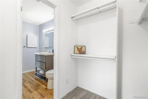 a bathroom with a sink toilet and mirror