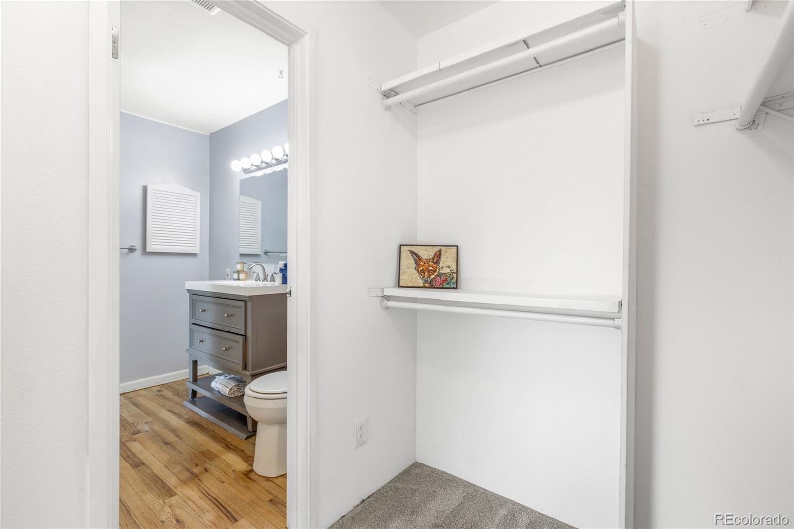 7755 East Quincy Avenue, Unit 205A5 Denver, CO 80237 - Photo 15 of 23 a bathroom with a sink toilet and mirror